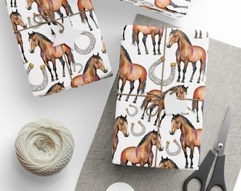 May include: Gift wrap featuring a repeating pattern of brown horses and silver horseshoes on a white background. The wrapped packages are tied with twine and have star-shaped tags. A ball of twine, scissors, and tags are also visible.