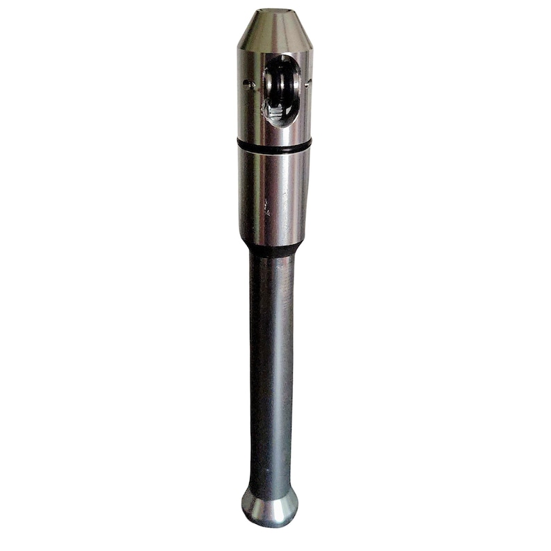 May include: A silver-colored metal tool with a cylindrical body and a rounded base. The top section has a unique design with a small opening and a rotating mechanism. The tool is designed for a specific purpose.