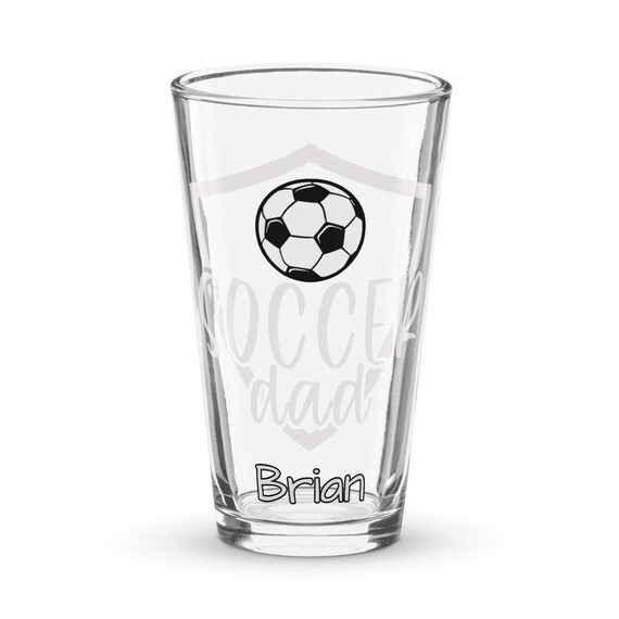 Een Glas Bier is Op Een Voetbalgebied, Wordt De Voetbal Gespeeld in Het