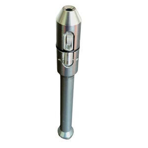 May include: A silver metal pipe with a cylindrical body and a conical top. The pipe features a sliding mechanism and a small opening at the top. The bottom of the pipe has a rounded base.