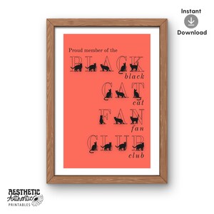 May include: A framed print with a coral background and the words "Proud member of the BLACK CAT FAN CLUB" in black. The word "BLACK" is spelled out with cat silhouettes. The print has a wooden frame and the words "Instant Download" are in the upper right corner.