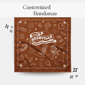 May include: A brown bandana with white illustrations and text. The bandana features a central design that reads "Emily's Nashville Bachelorette Weekend." Other illustrations include cowboy boots, a cowboy hat, and a cactus. The text "Let's Go Girls" is also included.