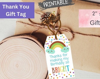 May include: Printable 2 x 3.5 inch gift tag with a rainbow, clouds, and the text "Thanks for making my Birthday so BRIGHT".