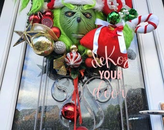 CHRISTMAS WREATH character holding small present sack and bauble with jingle bells