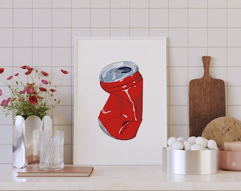 May include: A framed illustration of a red crushed aluminum can against a white background. The illustration is displayed on a white tiled wall above a kitchen counter with dark gray cabinets.