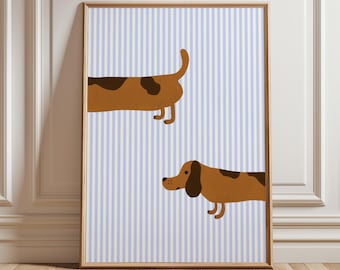 May include: A framed print with a blue and white striped background featuring two brown and black dachshund dogs. One dog is facing the left and the other is facing the right.