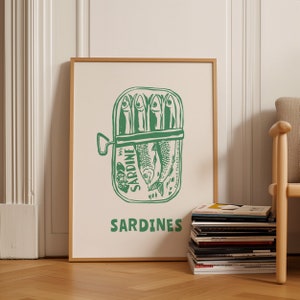 May include: A green and white poster with an illustration of a can of sardines. The can has the words "We Sardine" printed on it. The poster also has the word "SARDINES" printed in large letters at the bottom.