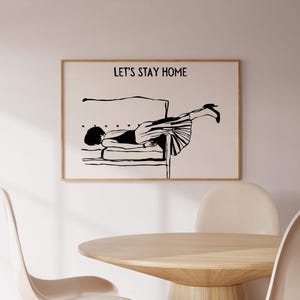 May include: Black and white illustration of a person doing a handstand on a couch. The text "Let's Stay Home" is above the illustration.