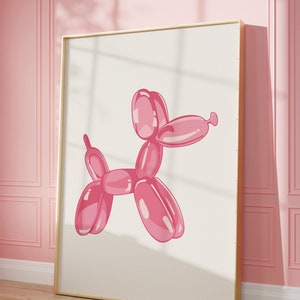 Puede incluir: Un animal de globo rosa con forma de perro, en un marco dorado, contra una pared rosa.