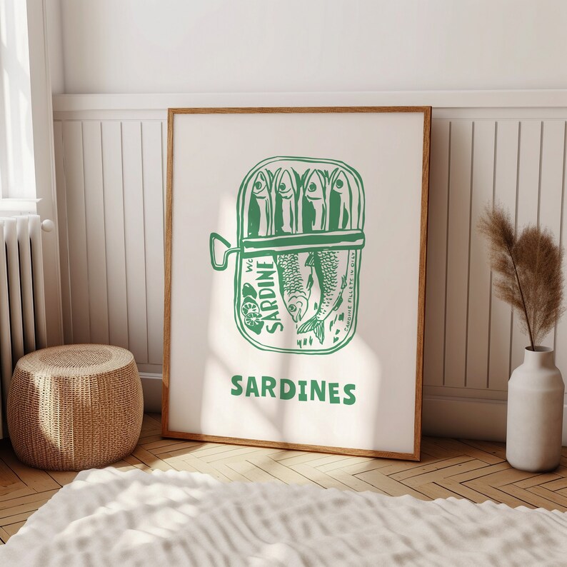 May include: A green and white illustration of a can of sardines with the text "SARDINES" printed below. The can has the words "WC SARDINE" printed on the side.