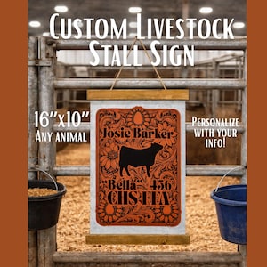 May include: Custom livestock stall sign, 16" x 10", with engraved leather detail. The sign features a black cow silhouette and the text "Josie Barker", "Bella 456", and "CHS FFA". The sign is designed to be personalized.