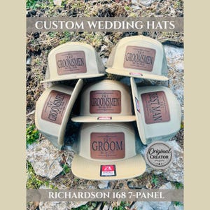 May include: A collection of tan and olive green flat-bill hats with leather patches. The patches are embossed with "GROOMSMEN", "BEST MAN", and "GROOM" with a date. The hats are labeled "RICHARDSON 168 7-PANEL" and "Original Creator".