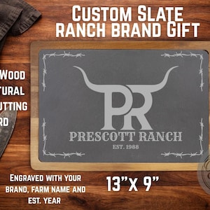 May include: Acacia wood and natural slate cutting board, 13" x 9", with a wooden frame. The slate is engraved with a ranch brand logo and the text "Prescott Ranch Est. 1988". Includes the text "Custom Slate Ranch Brand Gift".