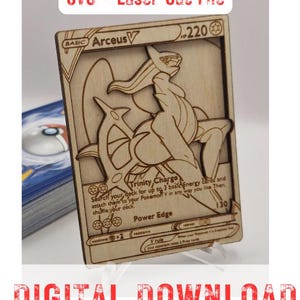 May include: A laser-cut wooden Arceus V Pokémon card. The card features the character's image and game details. The text "SVG - Laser Cut File" and "DIGITAL DOWNLOAD" are displayed in red at the top and bottom of the image.