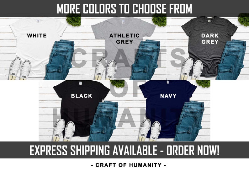 May include: Six t-shirts laid out on a white wood surface, showing different colour options. The colours are white, athletic grey, dark grey, black, navy, and a light blue. The text "MORE COLORS TO CHOOSE FROM" is at the top of the image. The text "CRAFT OF HUMANITY" is at the bottom of the image.