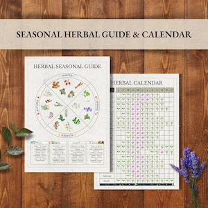 May include: Two printed guides on a wooden surface. The first guide is a seasonal herbal guide with a circular diagram and text. The second guide is a herbal calendar with a grid. The text "SEASONAL HERBAL GUIDE & CALENDAR" is at the top.