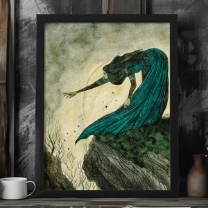 May include: A woman in a teal blue gown reaches out with her hand towards a moonlit sky. She stands on a rocky cliff with a forest in the background.