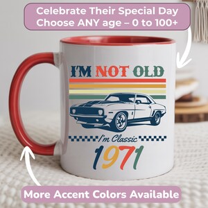 May include: White ceramic mug with a red handle and interior. The mug features the text "I'M NOT OLD" above a classic car illustration. Below the car is "I'm Classic 1971". Additional text reads "Celebrate Their Special Day Choose ANY age - 0 to 100+" and "More Accent Colors Available".