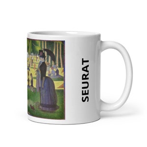 May include: White ceramic mug featuring a colourful image of people in a park, with the text "SEURAT" printed on the side of the mug.