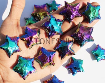 May include: A collection of iridescent rainbow star-shaped stones. The stones are a mix of purple, blue, green, and gold.