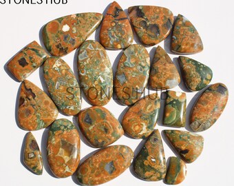 May include: A collection of 18 irregularly shaped, polished, green, brown, and orange jasper cabochons. The stones have a variety of patterns and textures.