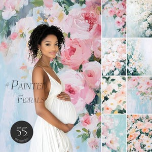 May include: A pregnant woman wearing a white dress stands in front of a floral backdrop. The backdrop features large pink and white flowers with green leaves. The text '#Painted Florals' and '55 Backdrops' is visible on the backdrop.