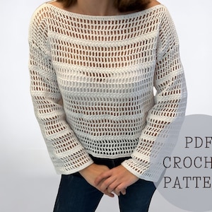 May include: A white crochet top with a loose fit and a wide, open neckline. The top has a striped pattern and a delicate, openwork design. The text "PDF CROCHET PATTERN" is visible in the lower right corner of the image.
