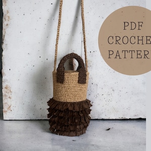 May include: A crochet bag with a brown and beige color scheme. The bag has a ruffled bottom and a brown strap. The bag is sitting on a concrete surface. PDF CROCHET PATTERN.