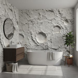 May include: A contemporary bathroom featuring a white bathtub, a dark wood vanity, and a circular black mirror. The walls have a textured, crater-like design. A small plant sits on a wooden stool beside the tub, and a towel hangs on the side.