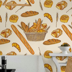 May include: A repeating pattern of baked goods, including baguettes, croissants, and rolls, on a cream-colored background. A basket filled with bread is in the center. Wheat stalks are interspersed throughout the design. The style is a hand-drawn illustration.