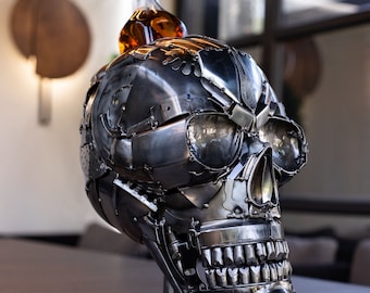 metal skull sculpture, bottle holder