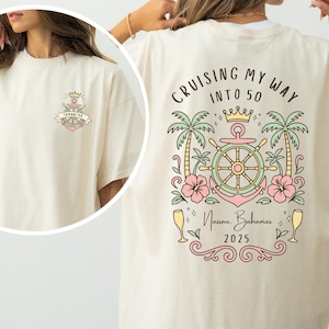 May include: Cream-colored t-shirt with a nautical design. The front features a small emblem with the name "Samantha." The back displays the text "Cruising My Way Into 50" with palm trees, a ship's wheel, and the words "Nassau, Bahamas 2025."