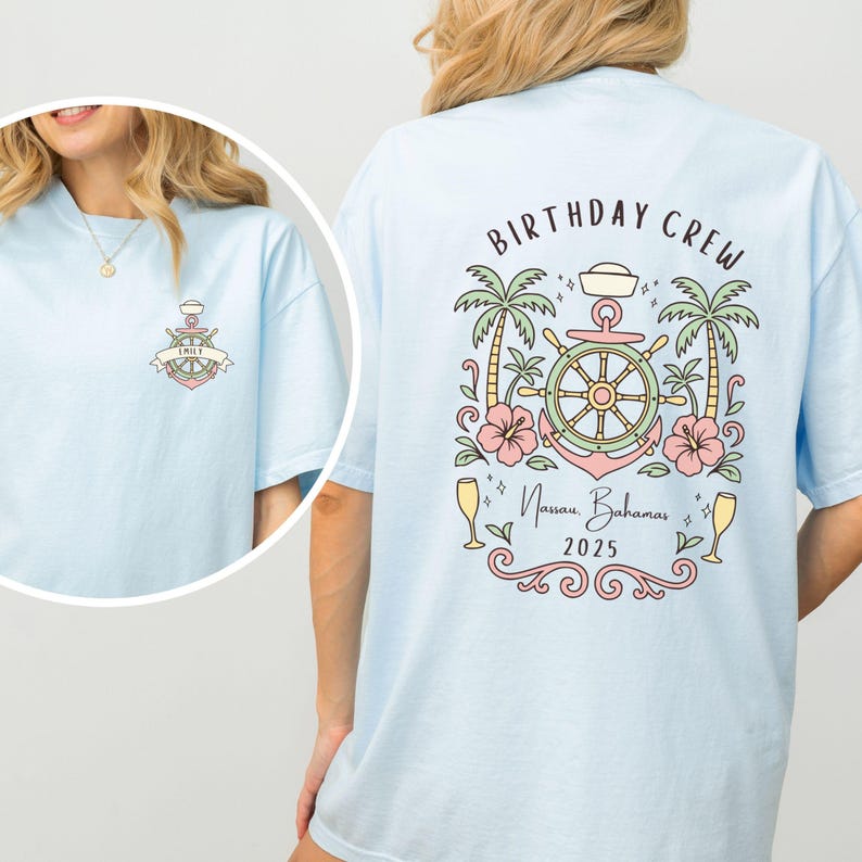 May include: Light blue t-shirt with a nautical-themed design. The front features an anchor with a banner that says "EMILY". The back has the words "BIRTHDAY CREW" above a design with a ship's wheel, palm trees, and the text "Nassau, Bahamas 2025".