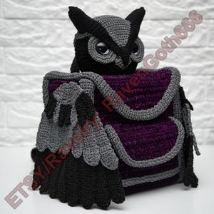 May include: A handmade crochet owl-shaped backpack in black, grey, and purple. The owl has large, round eyes and pointed ear tufts. The backpack features a flap closure and wing details. The text "ETSY/RavenGoth666" is visible.
