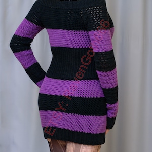 May include: A black and purple striped, off-the-shoulder crochet dress. The long-sleeved dress has alternating horizontal stripes of black and purple. The dress is form-fitting and appears to be handmade.