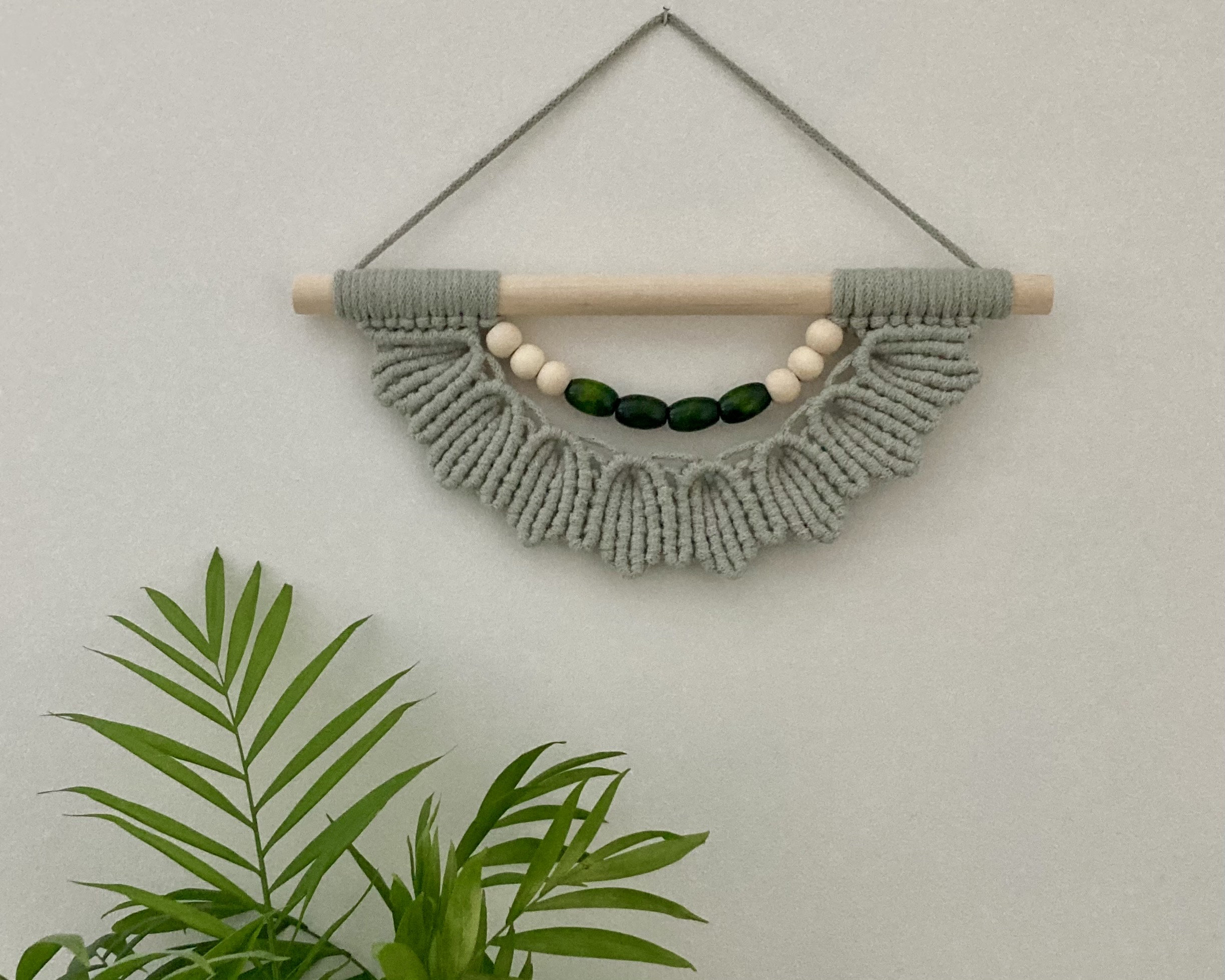 Unique Green Macrame Wall Hanging: Boho Wooden Bead Decor, wall art, hippy accessory.