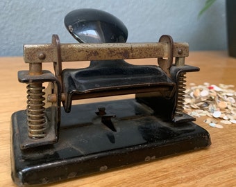 Old metal hole puncher office workplace vintage confetti