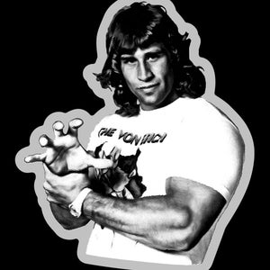 May include: Black and white illustration of a man with long hair, wearing a white t-shirt with the text "The Von Erich" printed on it. He is making a claw-like gesture with his right hand.