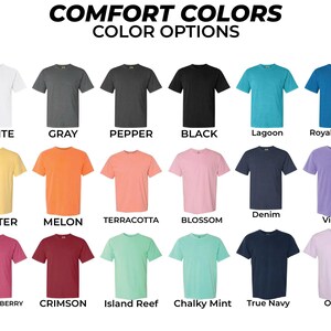 May include: A display of Comfort Colors t-shirts in various colors, including white, gray, black, lagoon, and royal caribe. The image also shows butter, melon, terracotta, blossom, denim, violet, crunchberry, crimson, island reef, chalky mint, true navy, and orchid.