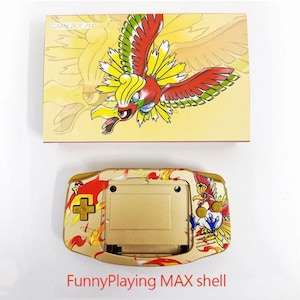 May include: A gold-coloured FunnyPlaying MAX shell for a handheld gaming device, with a colourful bird illustration in red, yellow, and green. The matching box above shows the same bird design.