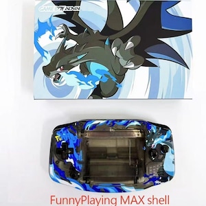 May include: A custom Game Boy Advance shell with a Charizard design. The shell is black and blue with a dragon graphic and the text "FunnyPlaying MAX shell". The top panel features the Game Boy Advance logo.