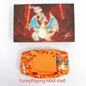 May include: An orange FunnyPlaying MAX shell for a handheld gaming device, featuring a Charizard design. The shell has a flame pattern and a picture of a scientist. A box with a Charizard illustration is above.