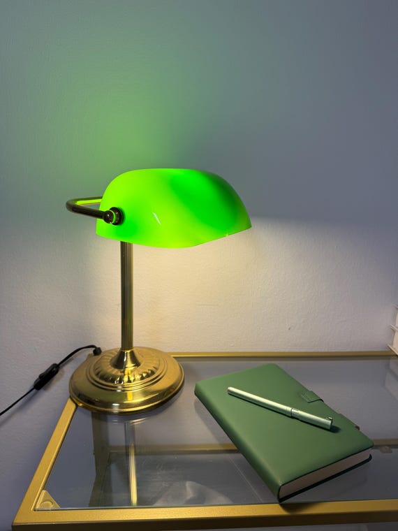 Classic Banker's lamp with a green glass shade on a desk