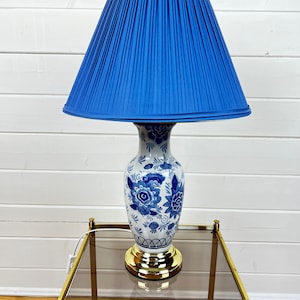 Porcelain table lamp with blue and white flowers and blue vintage lampshade