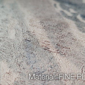 May include: A close-up view of a textured surface made of fine plaster, featuring a mottled pattern of light beige, grey, and dark charcoal streaks. The surface has a rough, uneven finish with visible grain-like markings. Text reads: Material: FINE PLASTER.