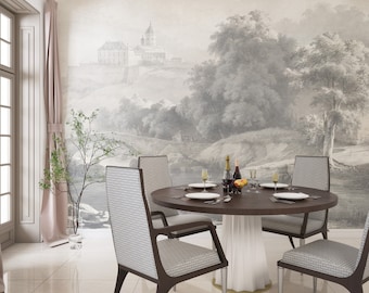 Pode incluir: Um conjunto de sala de jantar com uma mesa redonda de madeira escura com base branca e quatro cadeiras com estofamento cinza estampado. A parede atrás da mesa exibe um mural de um paisagem com um castelo, árvores e um rio.