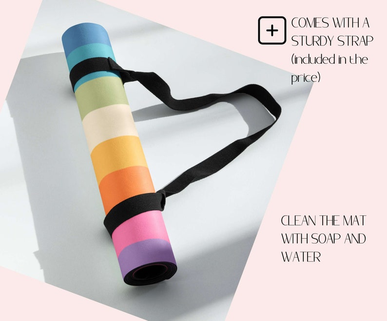 May include: A rolled-up yoga mat with a rainbow pattern and a black carrying strap. The text "COMES WITH A STURDY STRAP (induded in the price)" is visible in the upper right corner. The text "CLEAN THE MAT WITH SOAP AND WATER" is visible in the lower right corner.