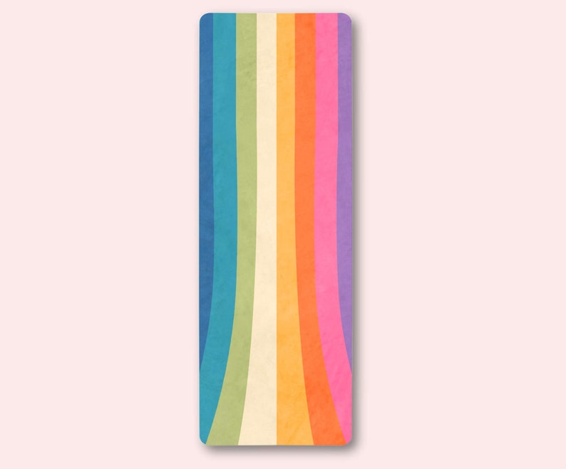 May include: A colorful yoga mat with a rainbow design. The mat has a textured surface and is perfect for yoga, pilates, or stretching.