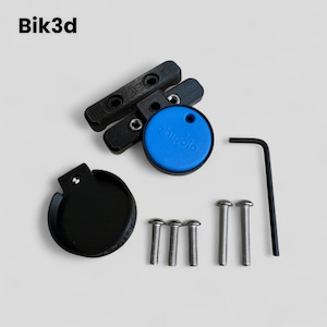 May include: A black plastic bike mount with a blue Tile Mate tracker attached. The mount includes four screws and an Allen key.