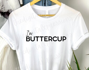 May include: White t-shirt with black text that reads "I'm Buttercup"